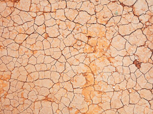 An illustration of what dry eyes can feel like, cracked and brittle earth surface