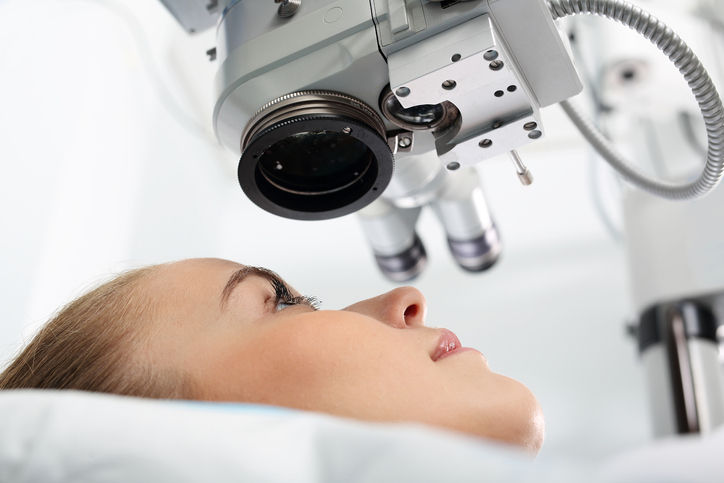 Eye doctor during the treatment of vision refractive surgery