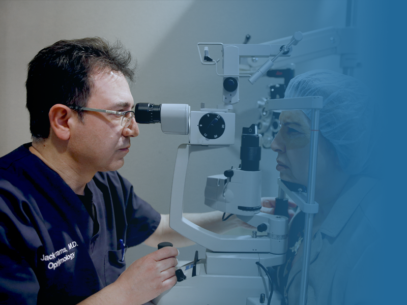 Dr. Abrams peering into the retina of a patient